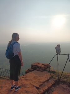 photo of me the blogger and a monkey on the top of the lion's rock